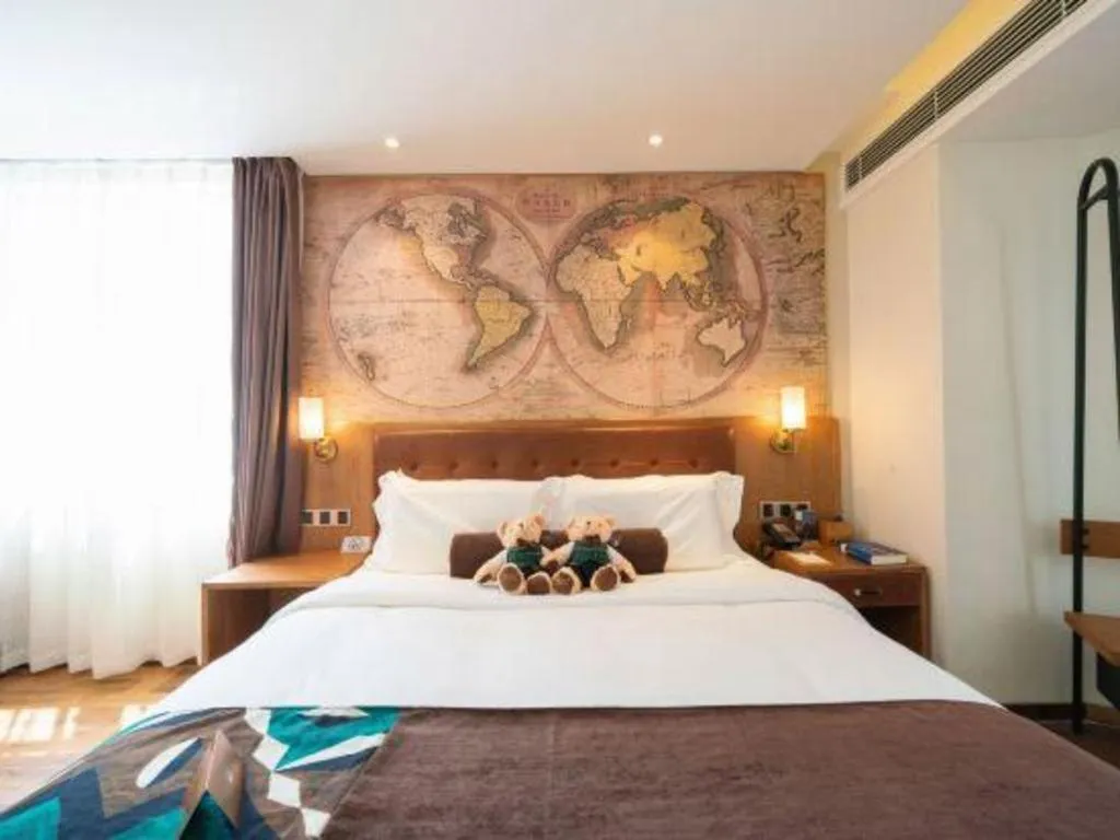 Bed in James Joyce Coffetel Shenyang North Railway Station Qishan Road Metro Station