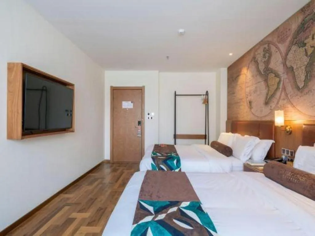 Bed in James Joyce Coffetel Shenyang North Railway Station Qishan Road Metro Station