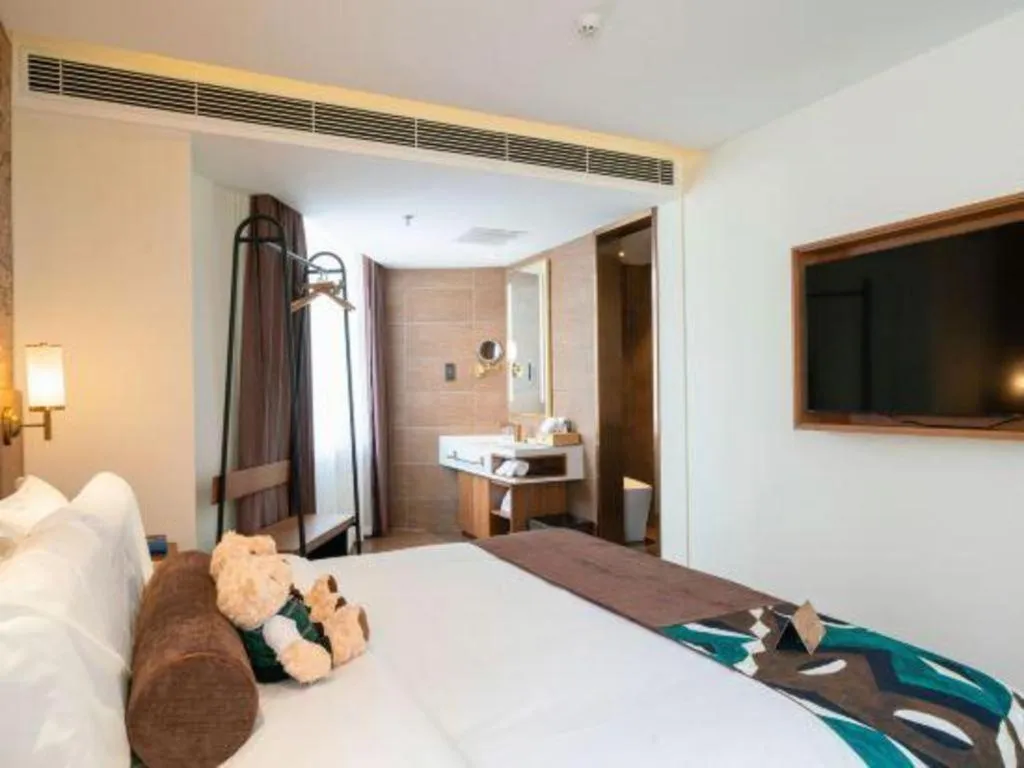 Bed in James Joyce Coffetel Shenyang North Railway Station Qishan Road Metro Station