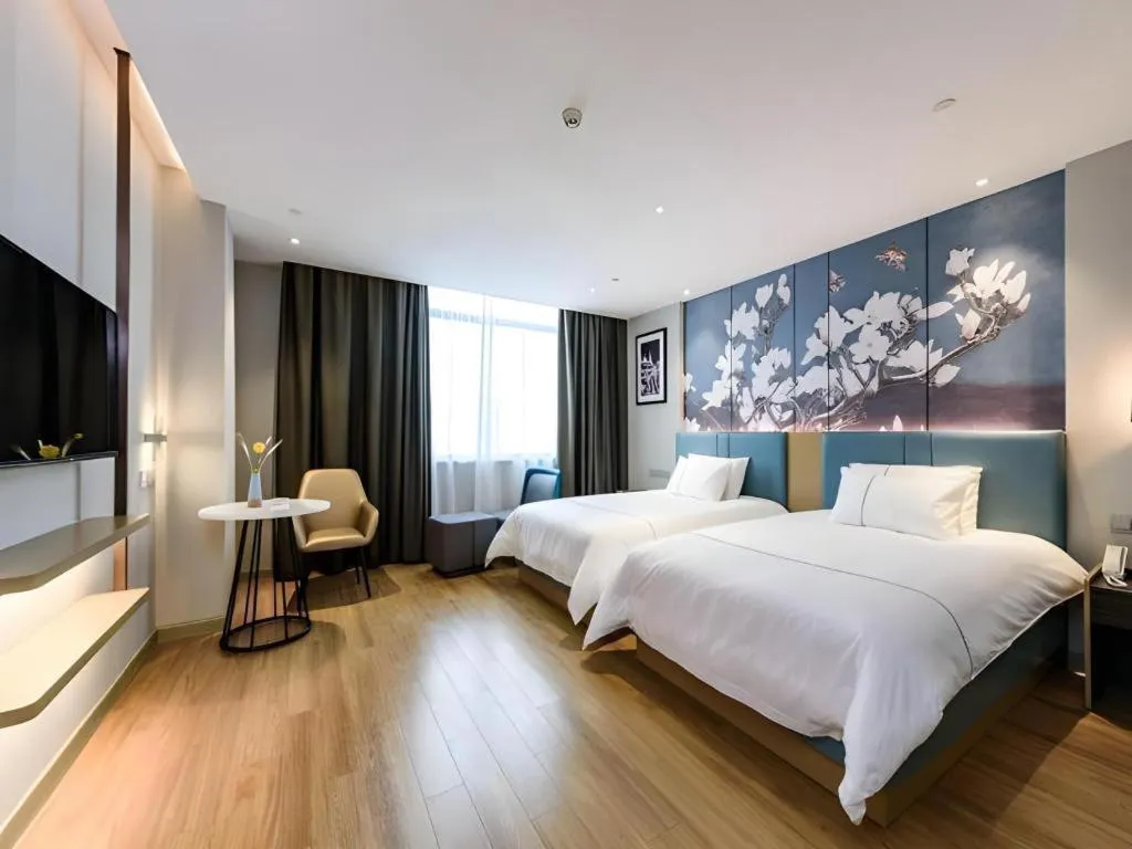 Bed in Magnotel Hotel Dongxing Guomen Port