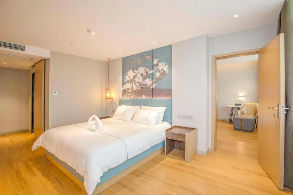 Bed in Magnotel Hotel Dongxing Guomen Port