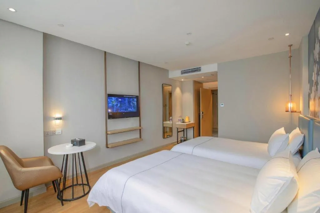 Bed in Magnotel Hotel Dongxing Guomen Port