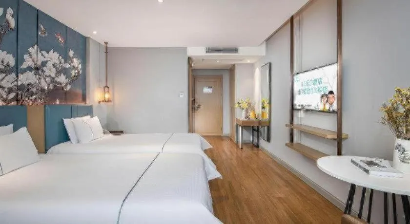Bed in Magnotel Hotel Dongxing Guomen Port