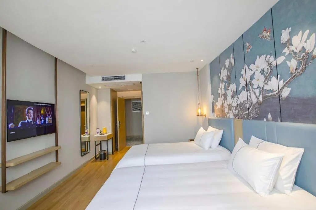 Bed in Magnotel Hotel Dongxing Guomen Port