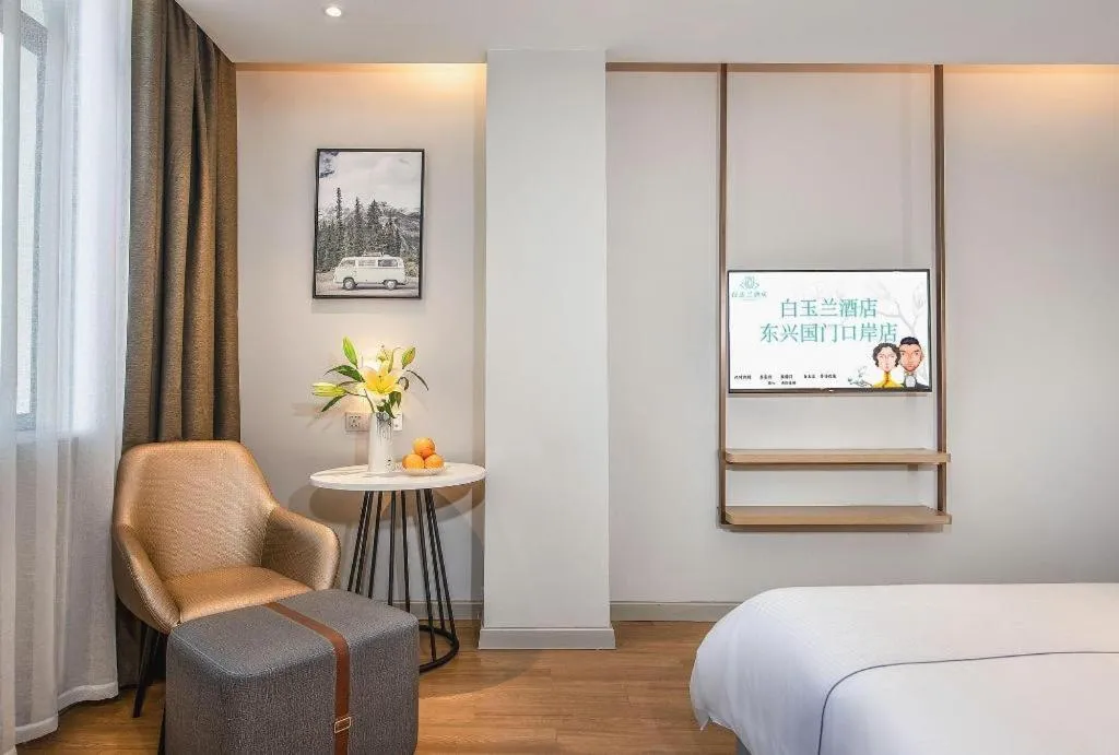 Bed in Magnotel Hotel Dongxing Guomen Port