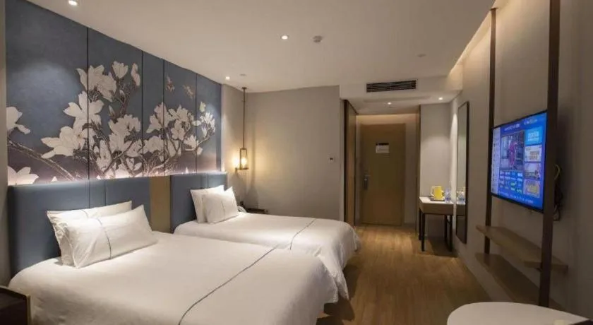 Bed in Magnotel Hotel Dongxing Guomen Port