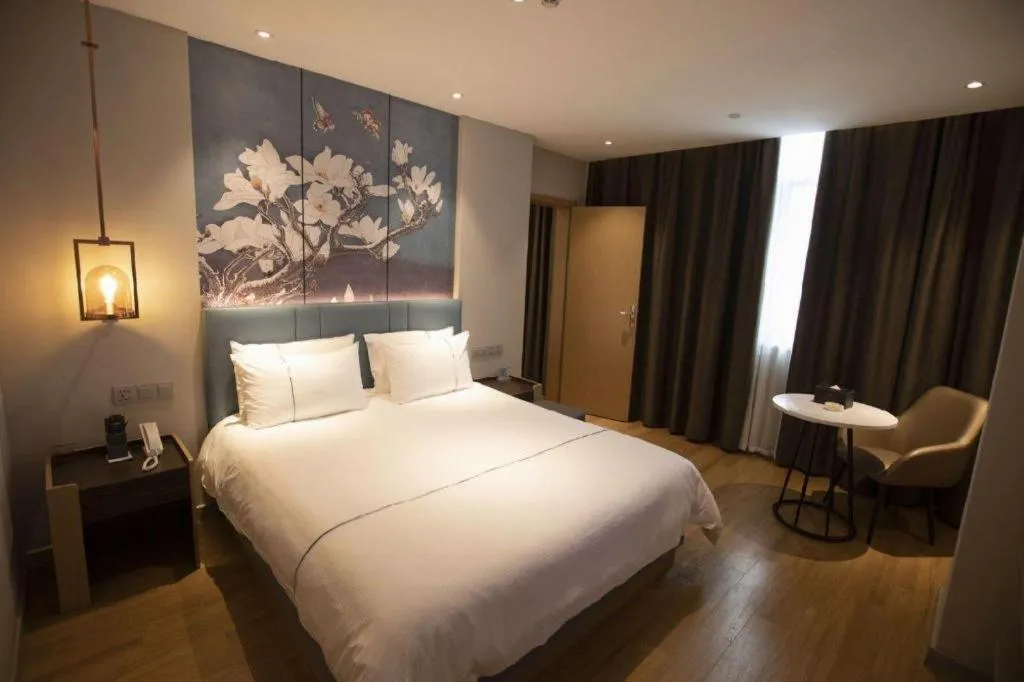 Bed in Magnotel Hotel Dongxing Guomen Port