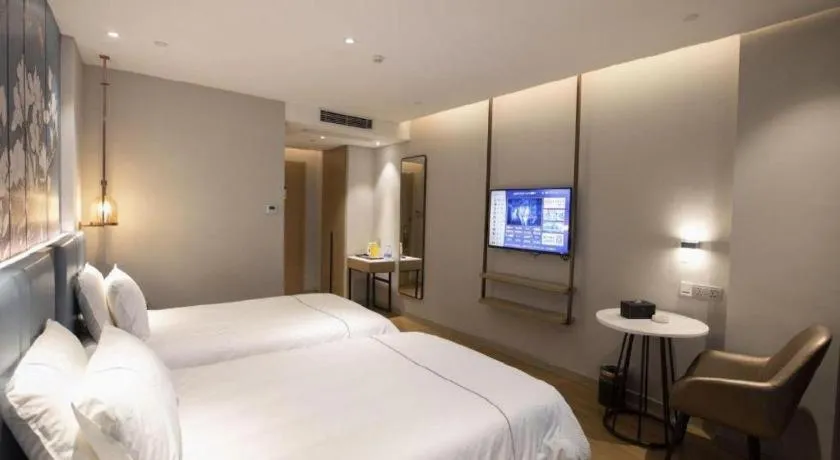 Bed in Magnotel Hotel Dongxing Guomen Port