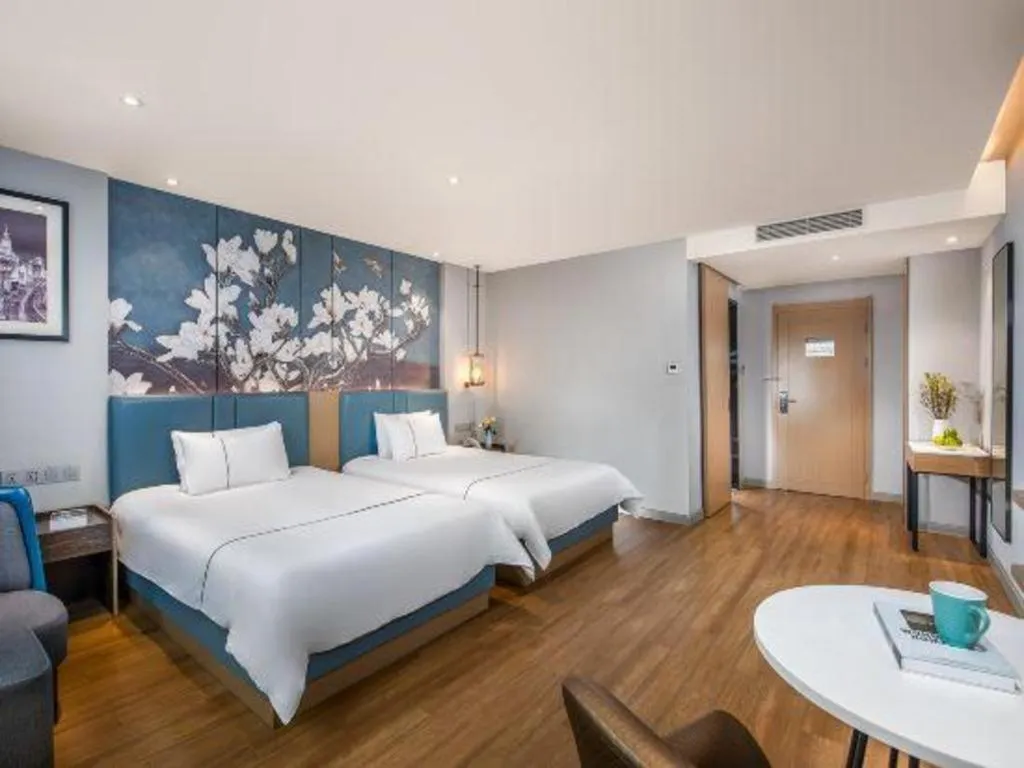 Bed in Magnotel Hotel Dongxing Guomen Port