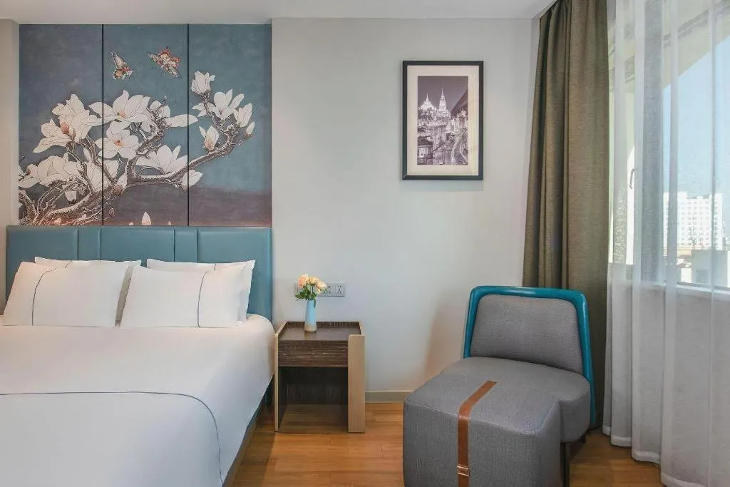 Bed in Magnotel Hotel Dongxing Guomen Port