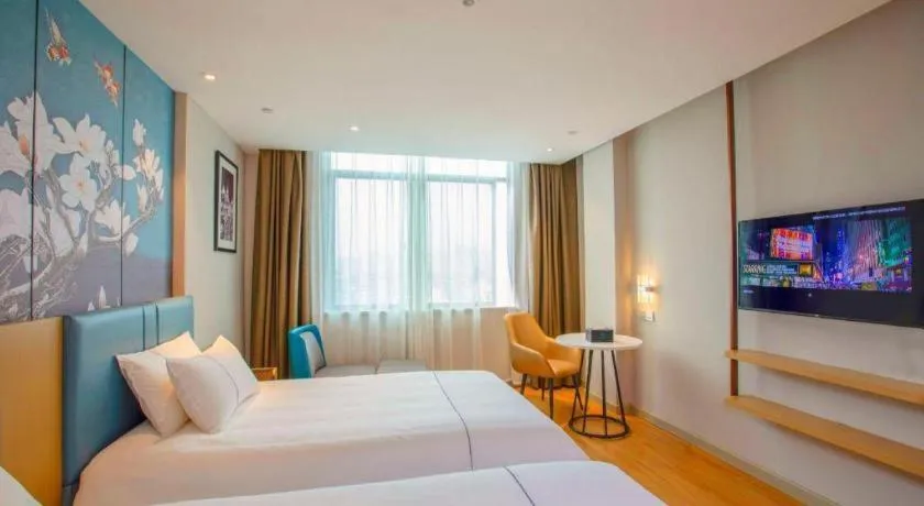 Bed in Magnotel Hotel Dongxing Guomen Port