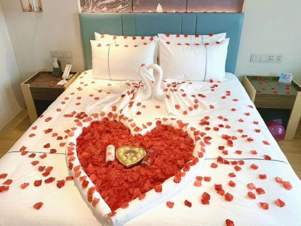 Bed in Magnotel Hotel Dongxing Guomen Port