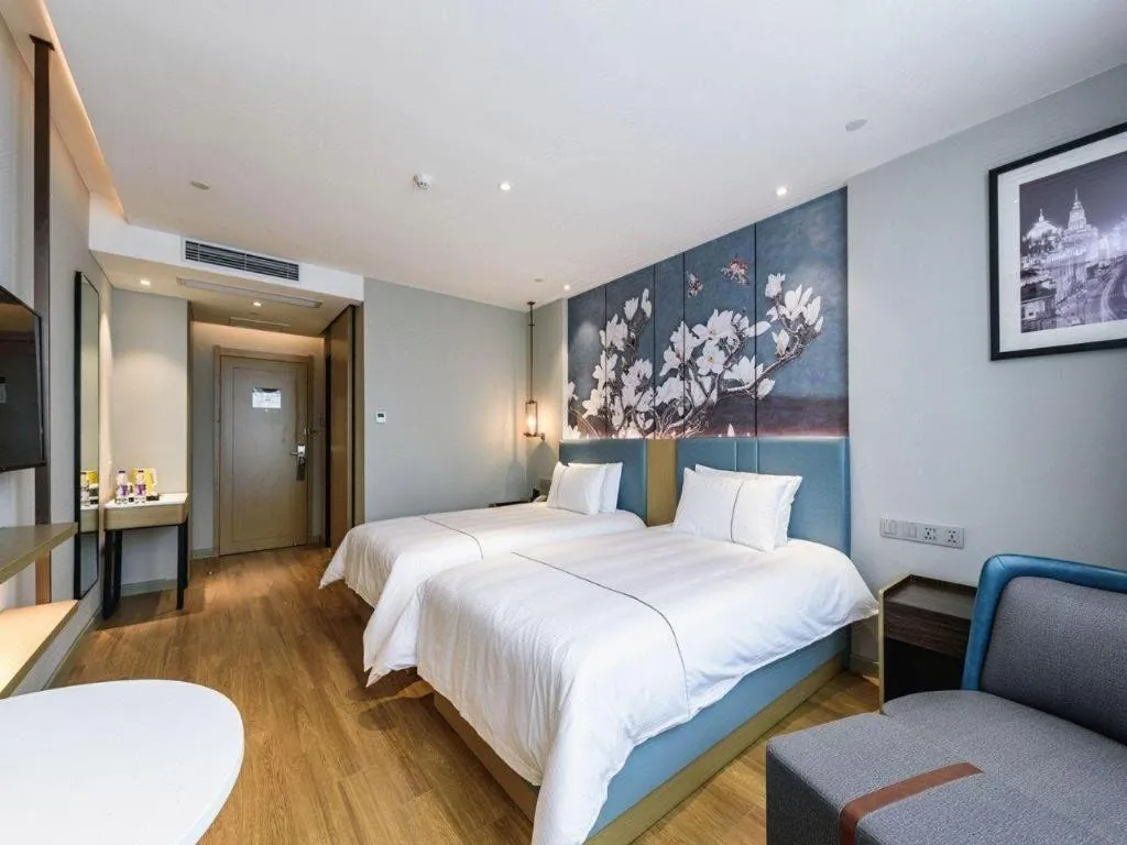 Bed in Magnotel Hotel Dongxing Guomen Port