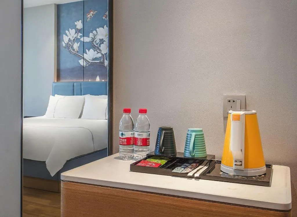 Bed in Magnotel Hotel Dongxing Guomen Port