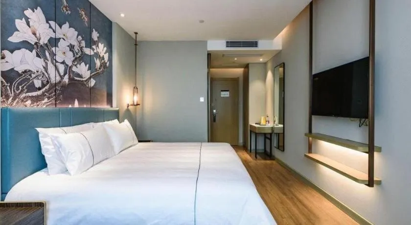 Bed in Magnotel Hotel Dongxing Guomen Port