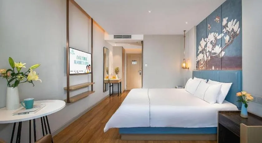 Bed in Magnotel Hotel Dongxing Guomen Port