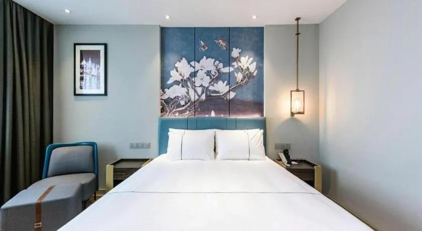 Bed in Magnotel Hotel Dongxing Guomen Port