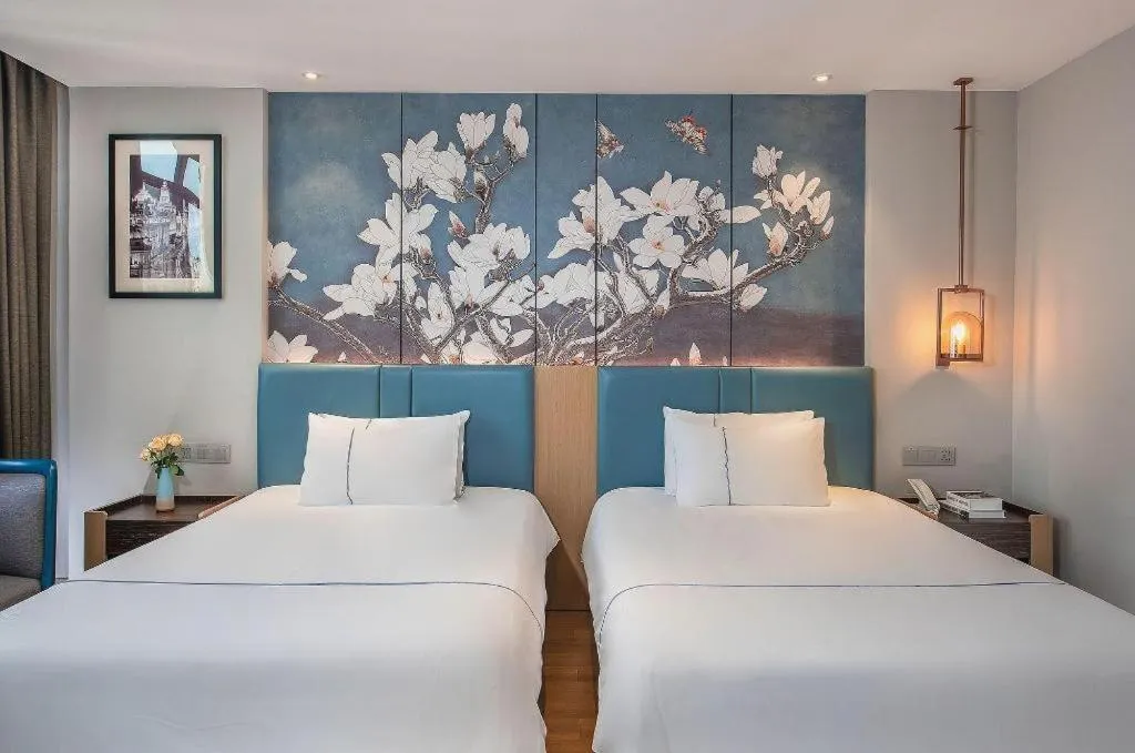 Bed in Magnotel Hotel Dongxing Guomen Port