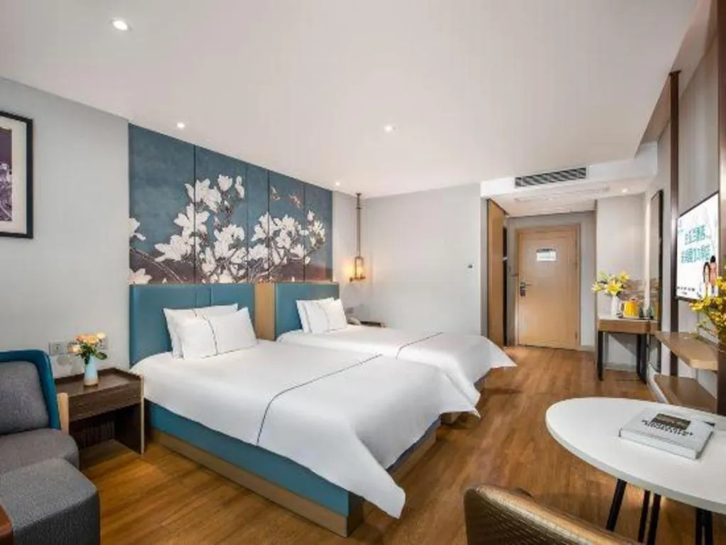 Bed in Magnotel Hotel Dongxing Guomen Port