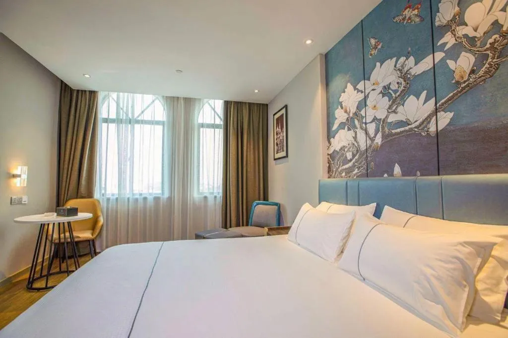 Bed in Magnotel Hotel Dongxing Guomen Port