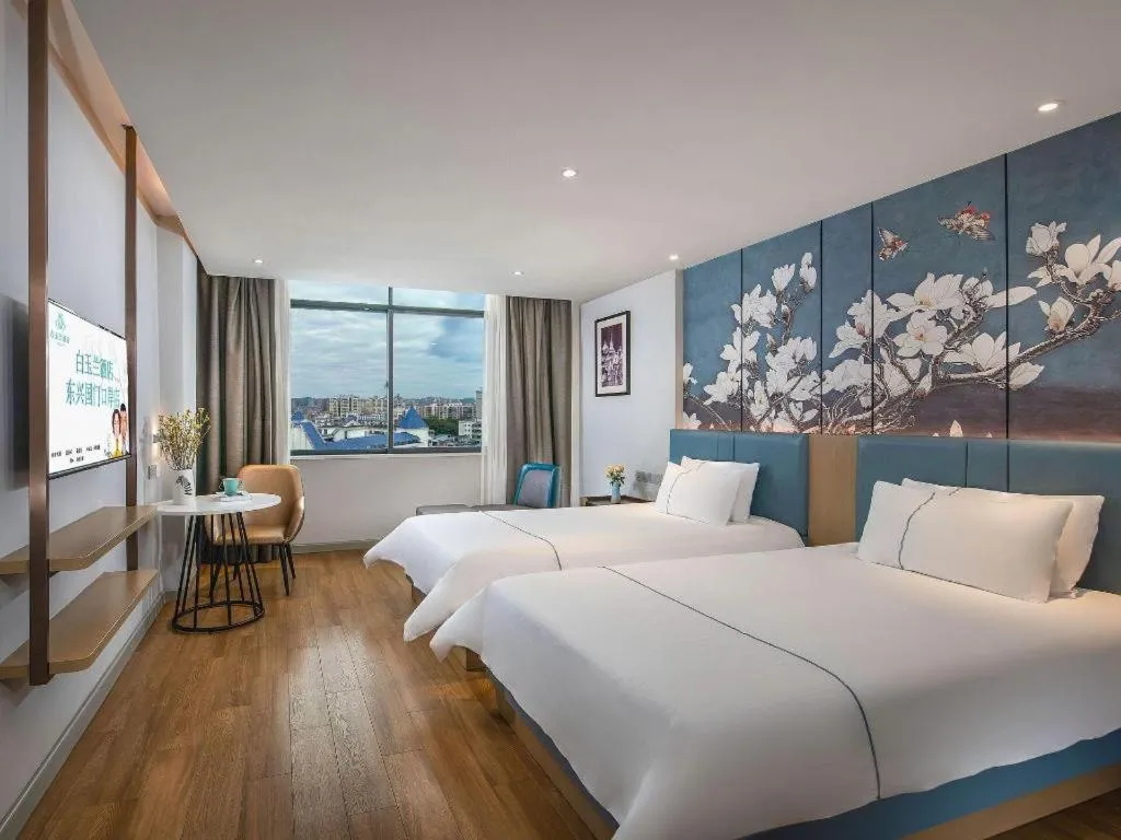 Bed in Magnotel Hotel Dongxing Guomen Port