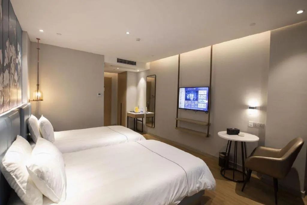 Bed in Magnotel Hotel Dongxing Guomen Port