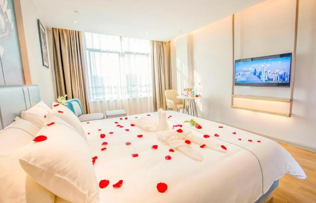 Bed in Magnotel Hotel Dongxing Guomen Port