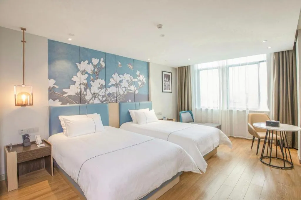 Bed in Magnotel Hotel Dongxing Guomen Port