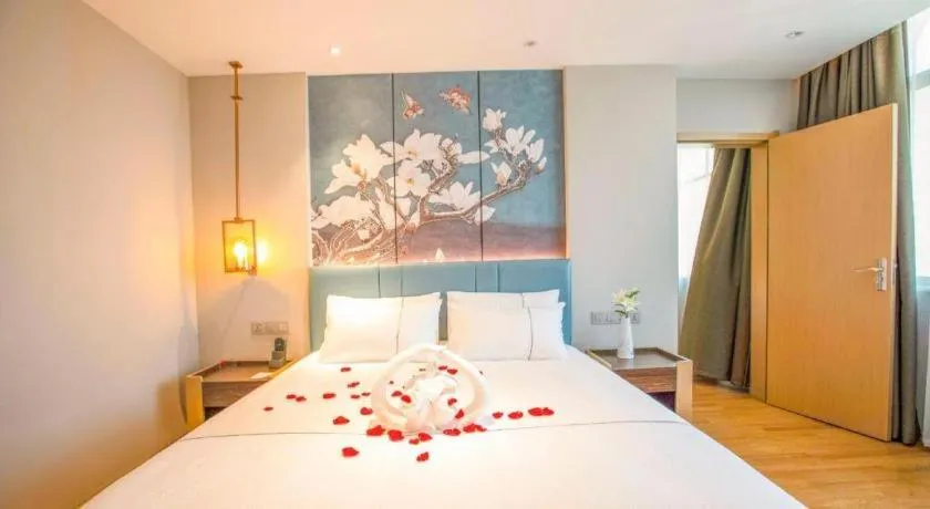 Bed in Magnotel Hotel Dongxing Guomen Port