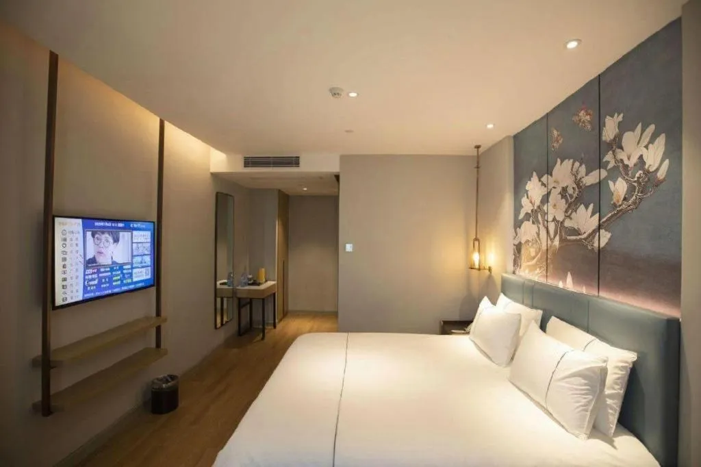 Bed in Magnotel Hotel Dongxing Guomen Port