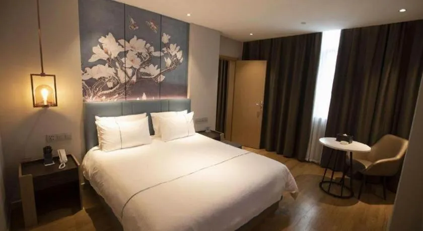 Bed in Magnotel Hotel Dongxing Guomen Port