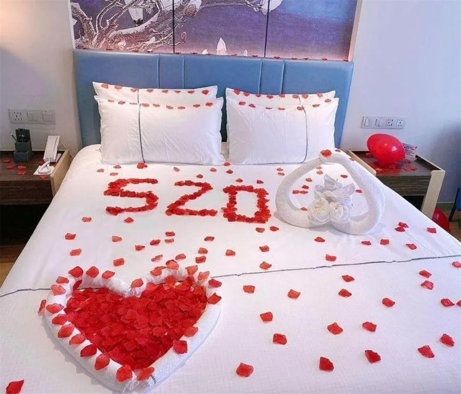 Bed in Magnotel Hotel Dongxing Guomen Port