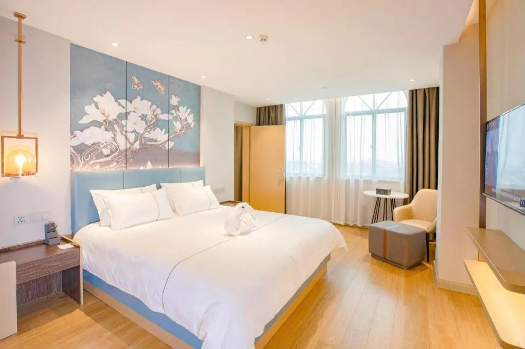 Bed in Magnotel Hotel Dongxing Guomen Port