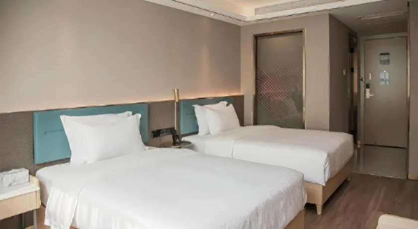 Bed in Zmax Hotel Guangzhou Railway Station