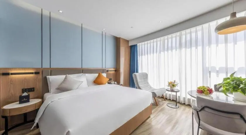 Bed in YUN-RAY Ambassador Hotel