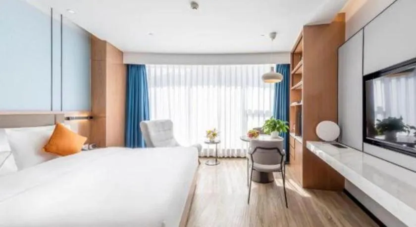 Bed in YUN-RAY Ambassador Hotel