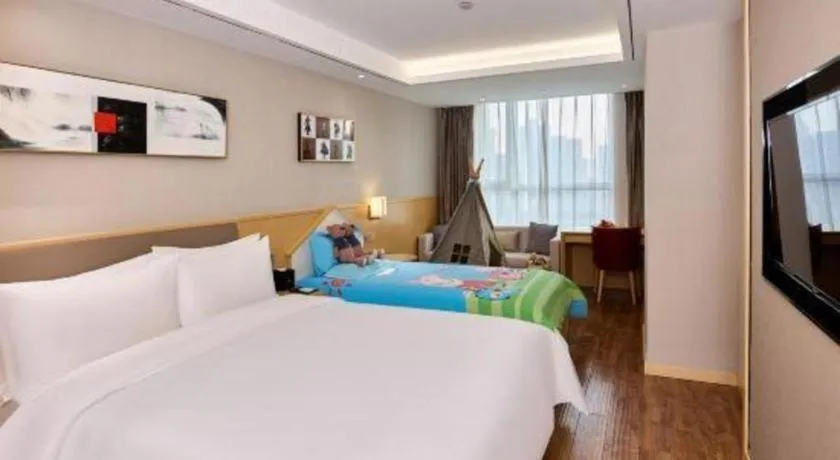 Bed in YUN-RAY Ambassador Hotel