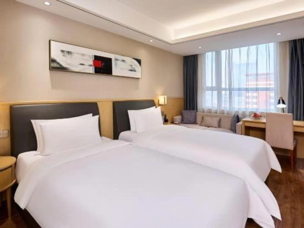 Bed in YUN-RAY Ambassador Hotel