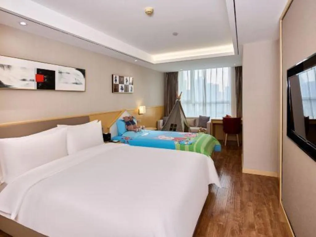 Bed in YUN-RAY Ambassador Hotel