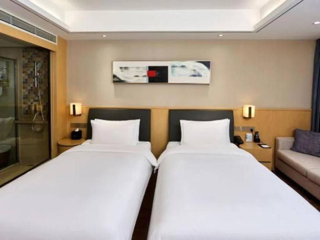 Bed in YUN-RAY Ambassador Hotel