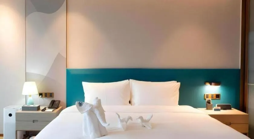 Bed in Zhuhai Hongsanyi Hotel