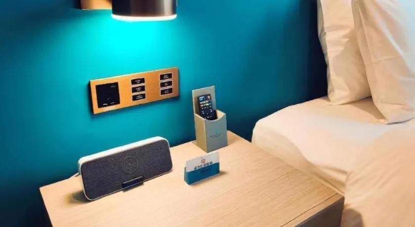 Bed in Zhuhai Hongsanyi Hotel