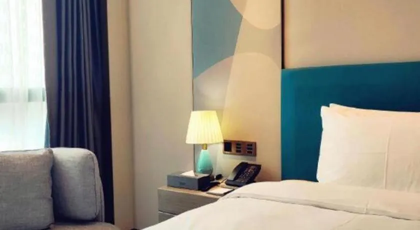 Bed in Zhuhai Hongsanyi Hotel