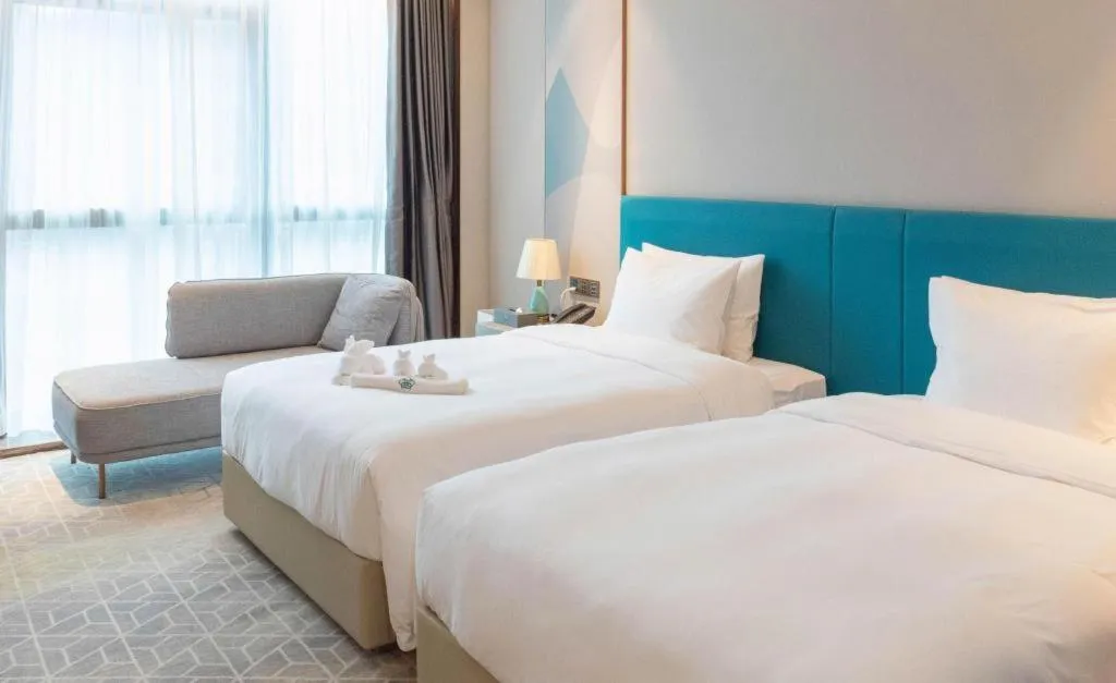 Bed in Zhuhai Hongsanyi Hotel