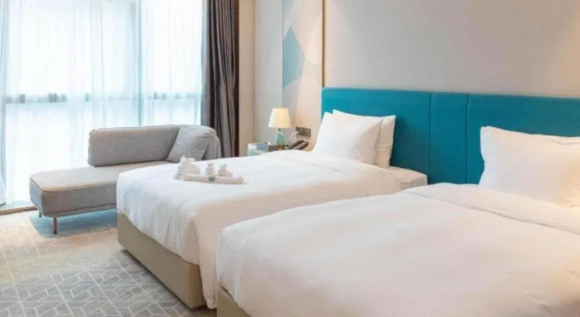 Bed in Zhuhai Hongsanyi Hotel