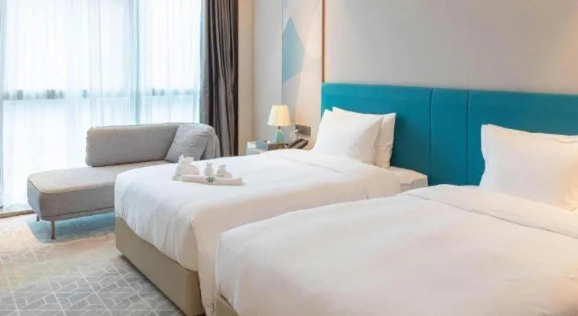 Bed in Zhuhai Hongsanyi Hotel