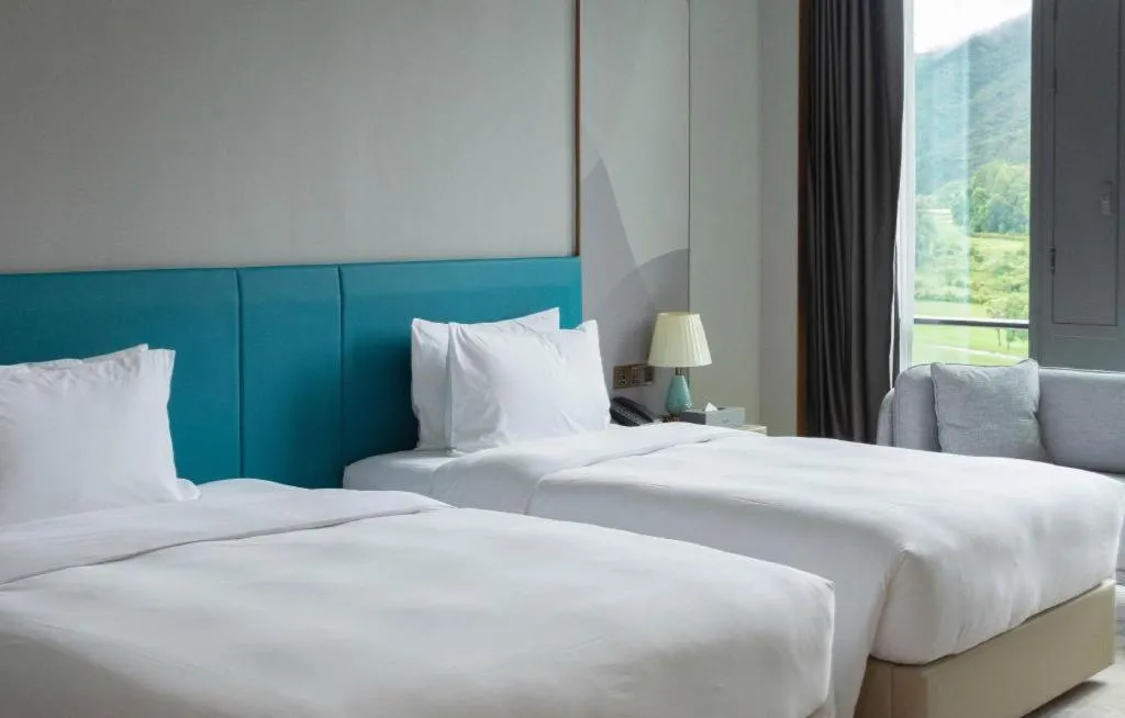 Bed in Zhuhai Hongsanyi Hotel