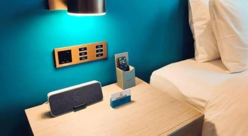 Bed in Zhuhai Hongsanyi Hotel