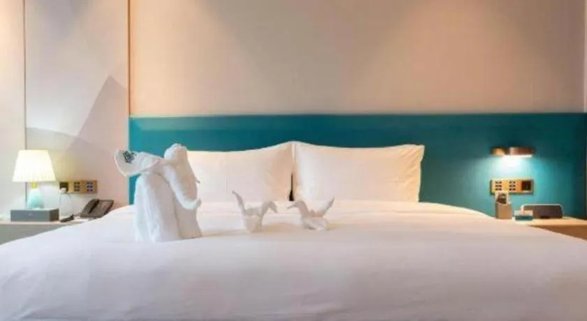 Bed in Zhuhai Hongsanyi Hotel