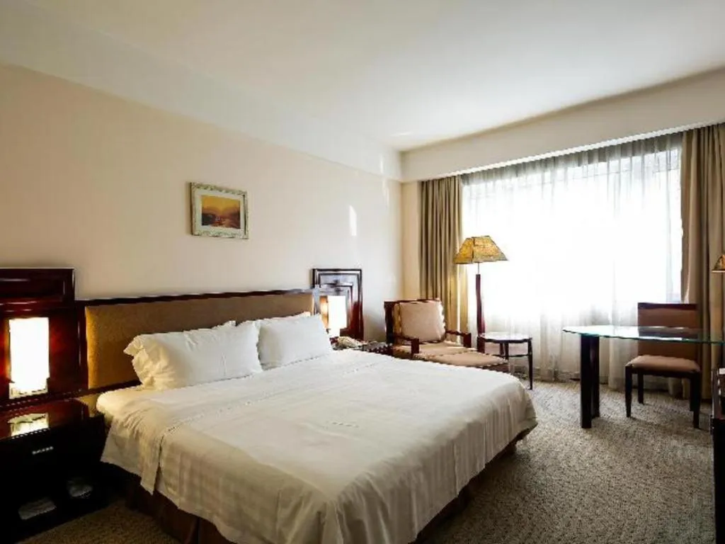 Bed in Hong Ye Hotel